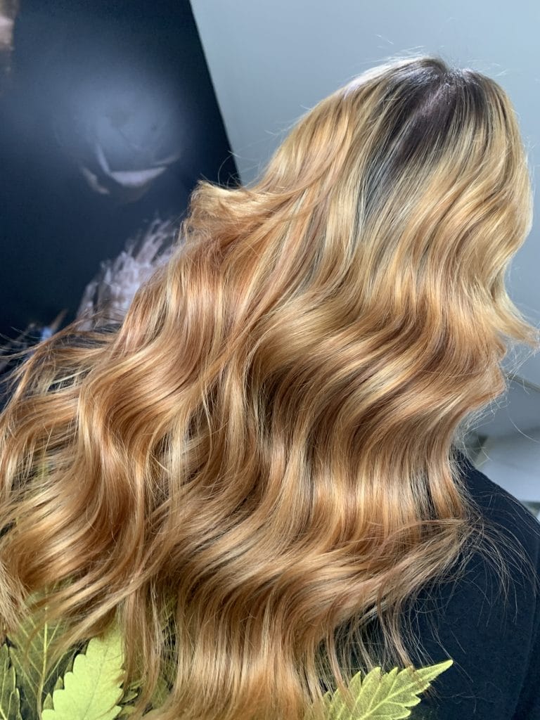 "Say goodbye to box dye and hello to a warm, natural-looking blonde with this expert color correction in St Kilda, Melbourne. Using freehand painting techniques, this transformation seamlessly blends warm tones to create a beautiful, multi-dimensional blonde hue."