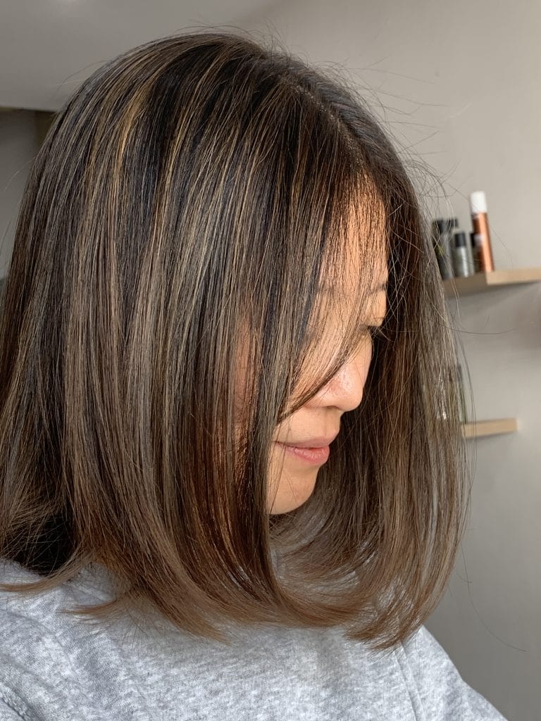 Beautiful brunette hair with subtle highlights, adding dimension and depth to naturally dark locks. This stunning hair color is located in the trendy St Kilda area of Melbourne.